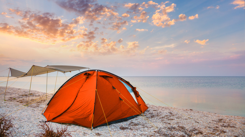 A tent set up on a sandy beach