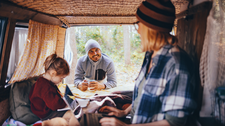 Family camping in a car