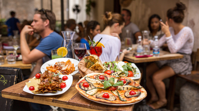 People eating at outdoor restaurant