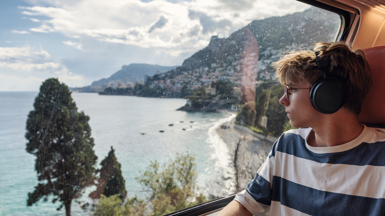 A young traveler rides the bus around the French Rivera