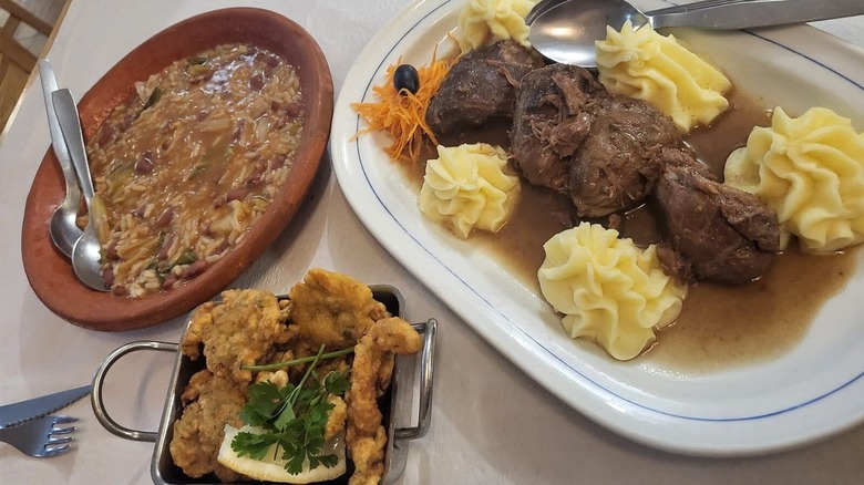 Traditional Portuguese dishes on a table at Taberna Santo Antonio