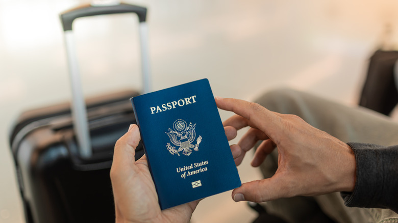 Traveler holding an American passport
