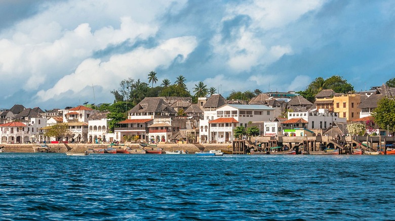 A string of homes in Kenya by the ocean