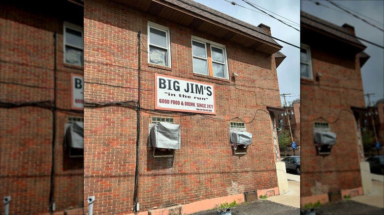 brick wall of Big Jim's restaurant with sign in Pittsburgh
