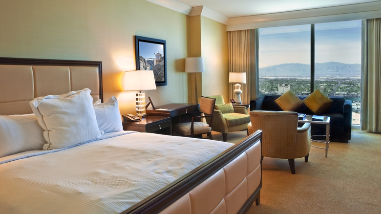 Bed and chairs in hotel room in las vegas