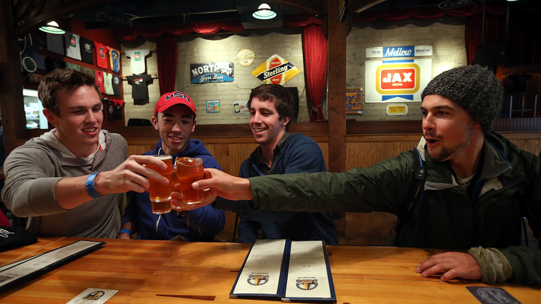 Customers at Russian River Brewing Company toast with ultra-rare Pliny the Youngers in hand