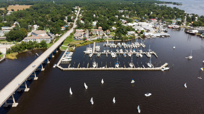 Sailboats at a regatta in front of the marina