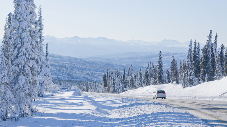 Car driving on the icy Dalton Highway in Alaska