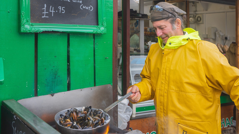 Man frying mussels in Oban, Scotland