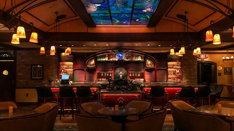 An extravagant restaurant and bar with vintage furnishings and decor in Club 33 at a Disney resort.