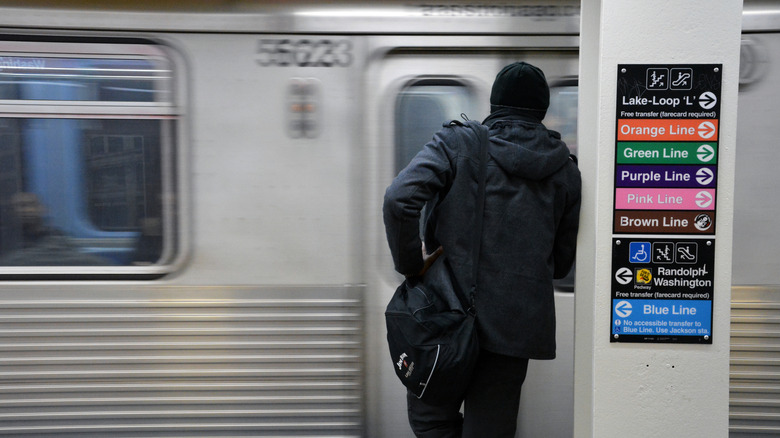 A man waits for the L train