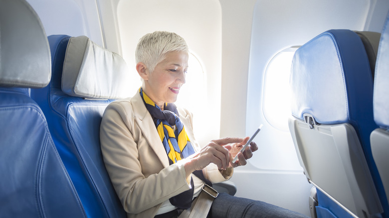 Someone smiling on a plane