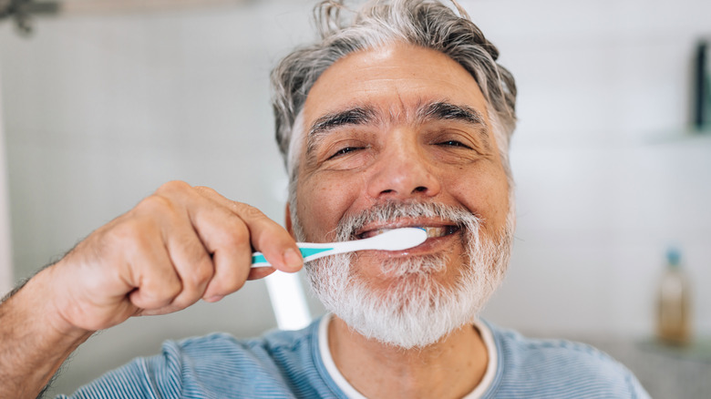 Someone brushing their teeth