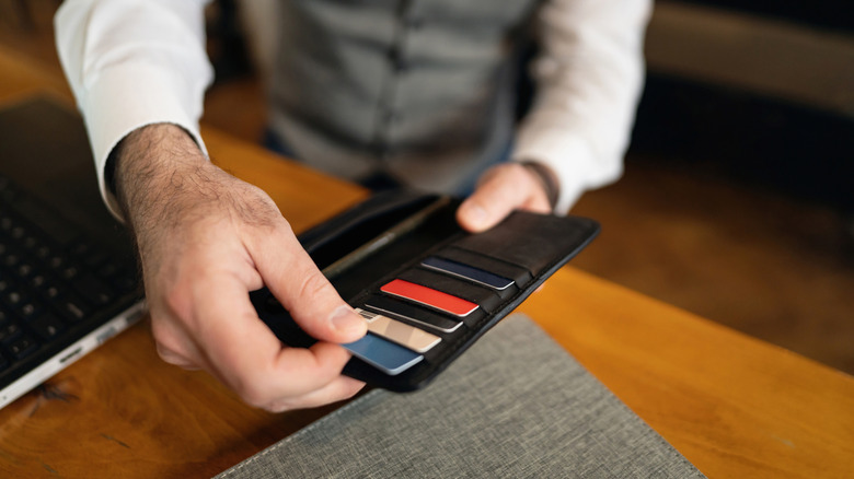 Person with credit cards in a wallet