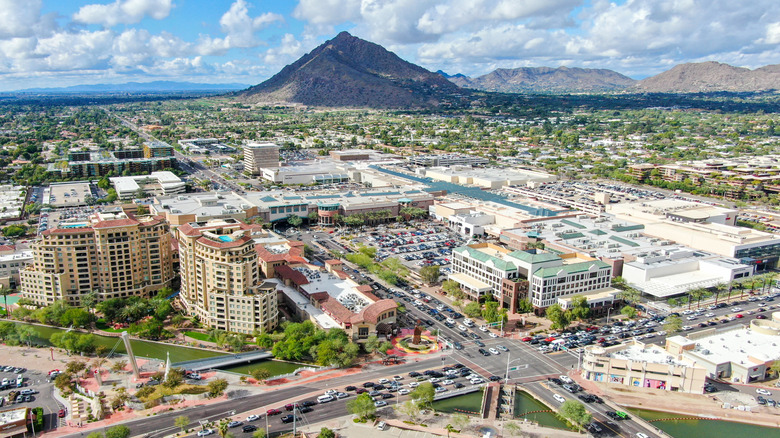 An aerial view of Fashion Square in Scottsdale, Arizona, with Camelback Mountain rising in the background