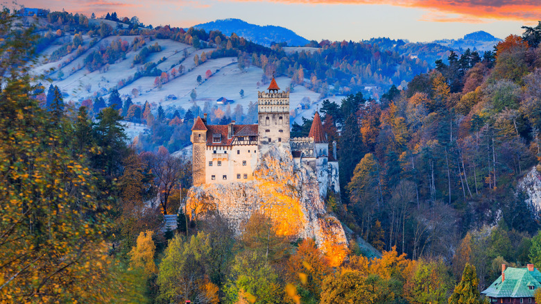 The medieval Castle of Bran, seen from a distance at sunset