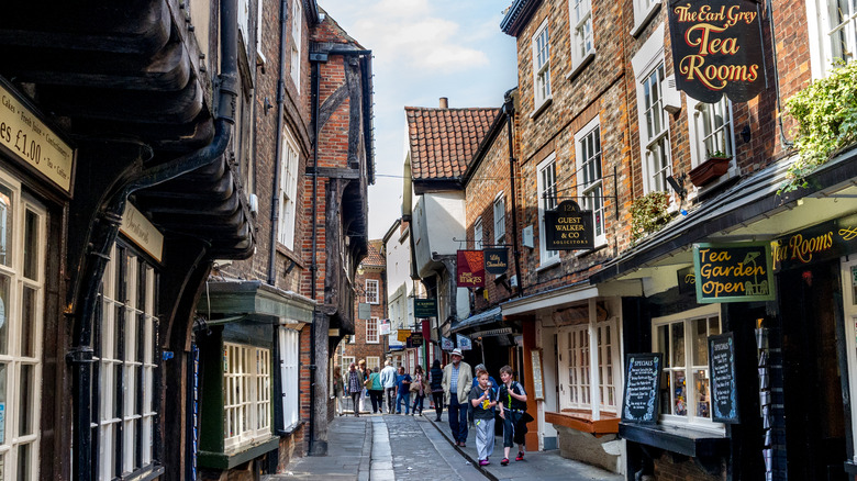 People walking down alleyway