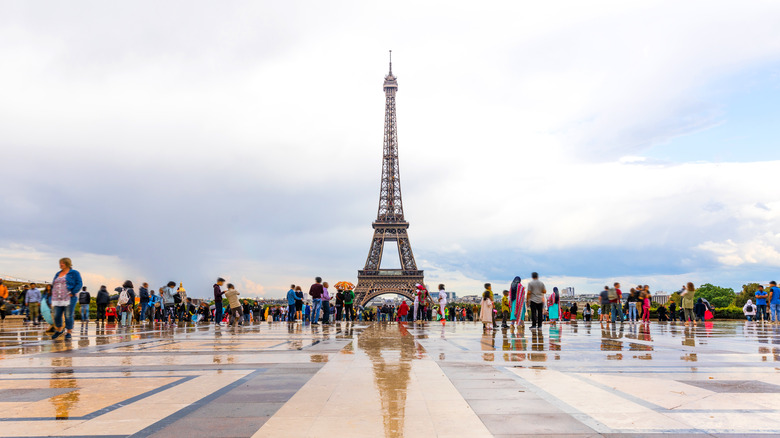 Woman smiling by Eiffel Tower