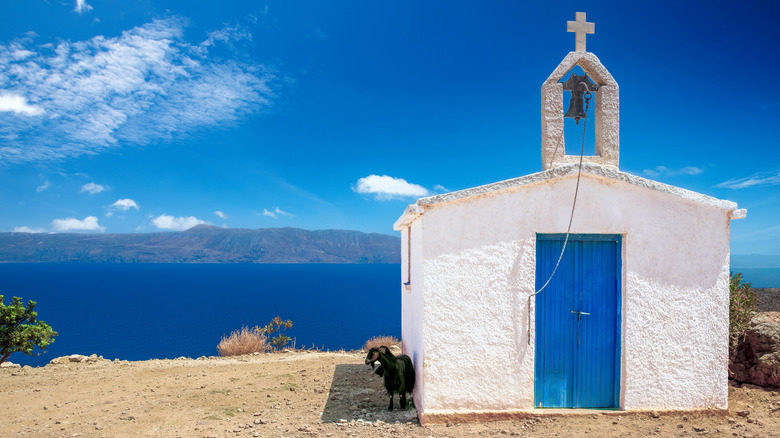 A chapel and a goat on the road to Balos Beach