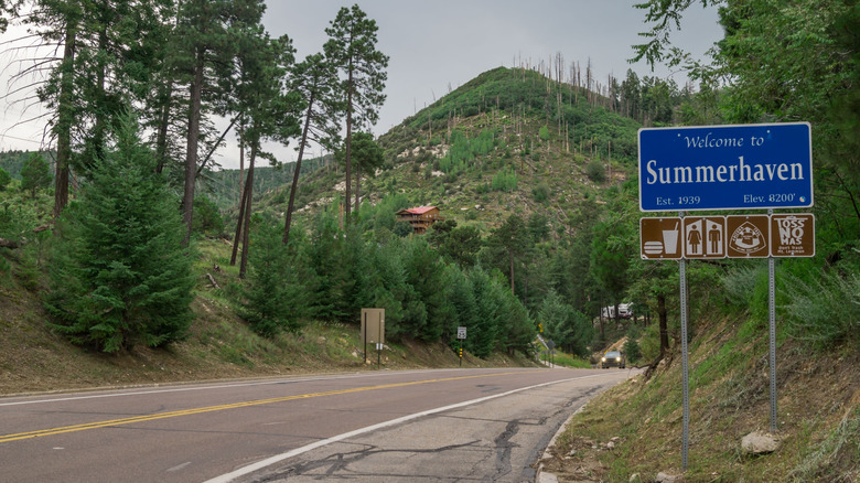 The highway with the town entrance sign to Summerhaven