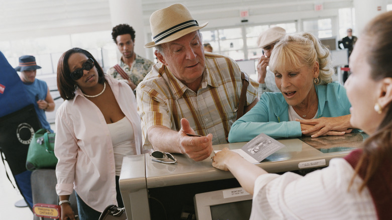 Upset people at airport customer service