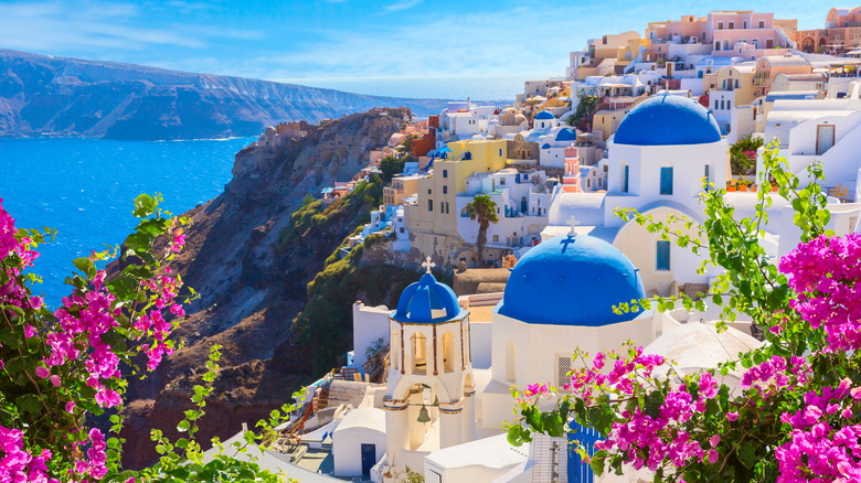 The blue-domed churches of Saint Anastasi and Saint Spyridon in Oia, Greece