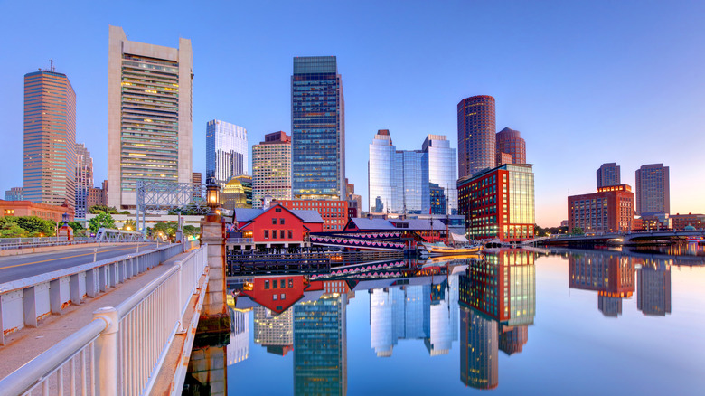 A shot of the Boston Seaport and city skyline reflected in water