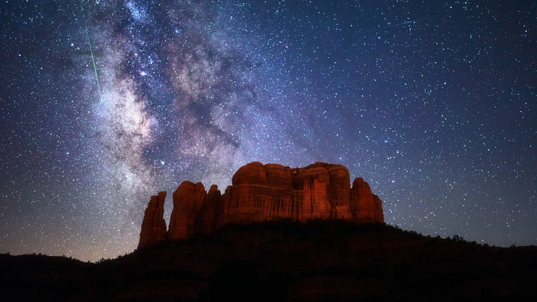Meteor and starry night over Cathedral Rock in Sedona