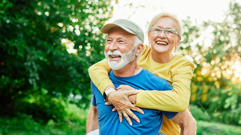 Senior couple hugging in nature