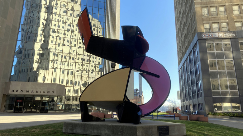 Glass sculpture in downtown Toledo surrounded by skyscrapers