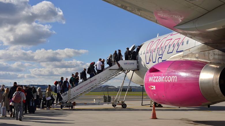 Passengers boarding plane at Warsaw airport