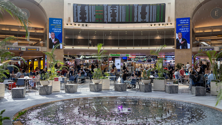 Passengers sitting at Ben Gurion tables