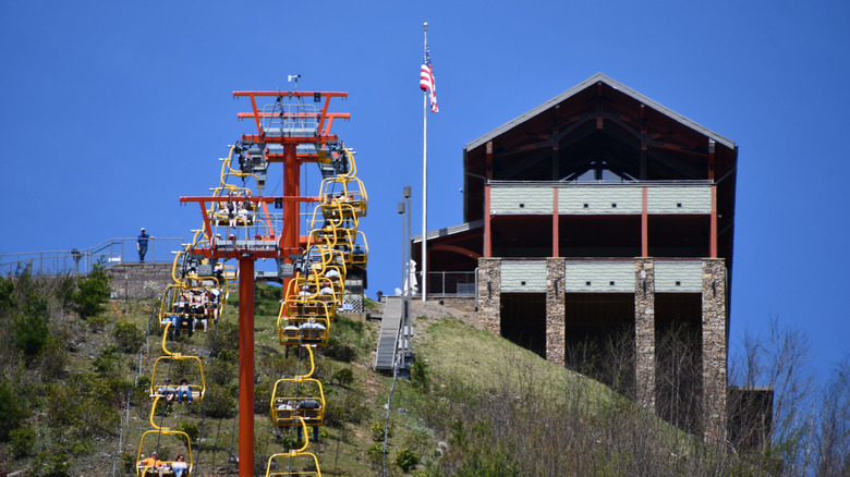 Yellow SkyLift chairs of Gatlinburg SkyPark against a blue sky