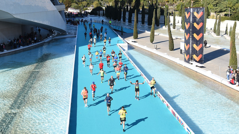 Runners in Valencia running through the City of Arts and Sciences