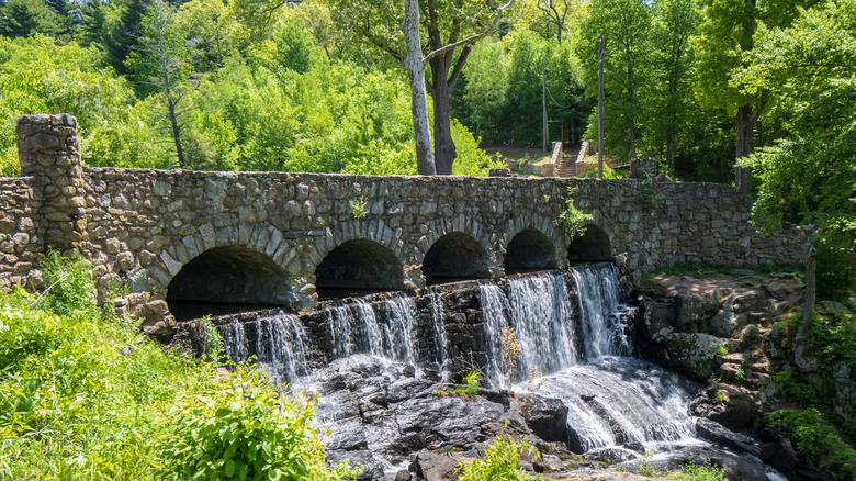 Waterfall under an old stone bridge at Case Mountain Recreational Area in Manchester, CT