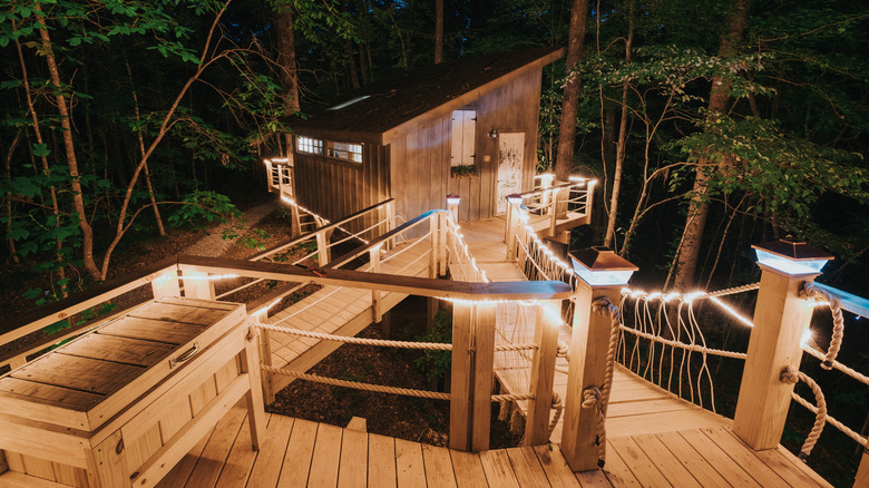 Nighttime, exterior view of the Majestic Treehouse, one of Bolt Farm's properties, in the forests of Walhalla in upstate South Carolina