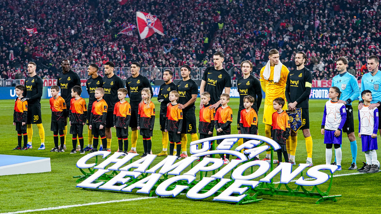 Players lined up during the UEFA Champions League anthem.