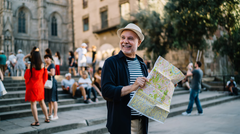 Man with a map on the streets of Italy