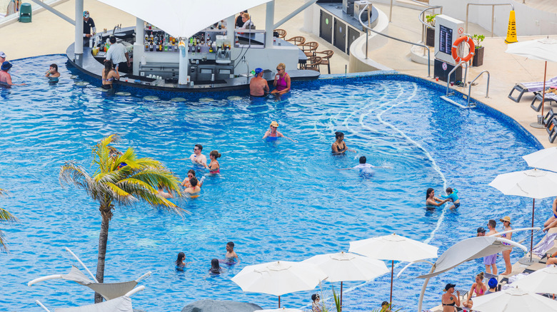 Resort guests relaxing in swimming pool