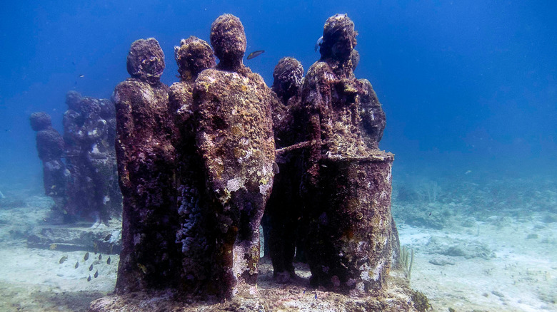 Underwater statues at the MUSA underwater museum near Cancun