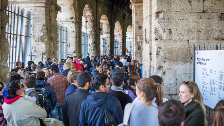 People waiting in line to get into the Roman Colosseum