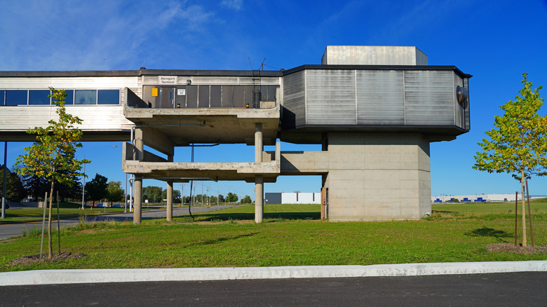 Old concrete structures stand outside Mirabel International Airport