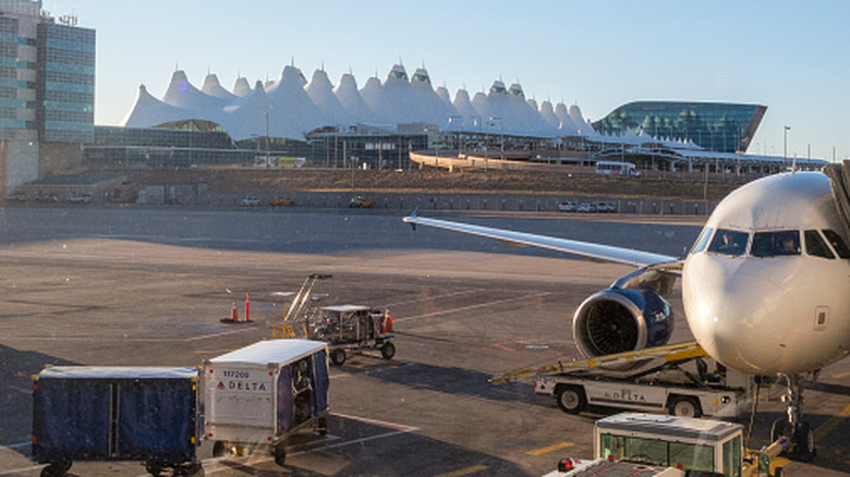 Exterior view of Denver International Airport, in Denver, Colorado, USA, from gate, as plane preps for takeoff
