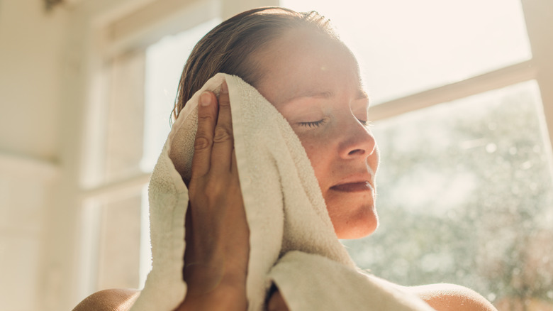 Woman drying off after shower