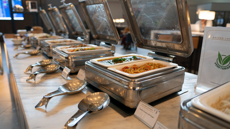 Hot food at an airport lounge's buffet station