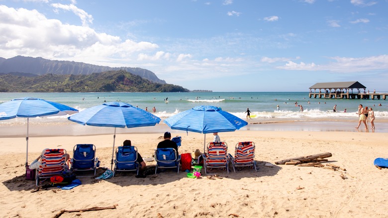 Tourists at Hanalei Bay Beach, Kauai
