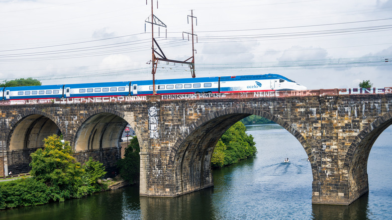 An Amtrak NexGen Acela crosses a bridge