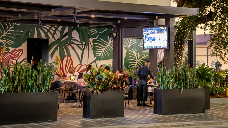 Patrons dine and socialize at the Moxies location in Miami, Florida