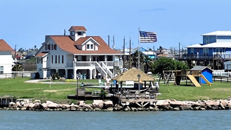 White house and dock on water in Freeport, Texas