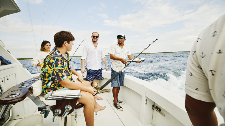 A group of people fishing on a boat